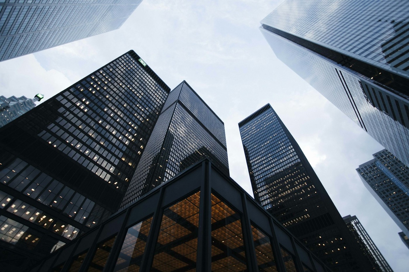 City buildings photographed looking upward against the sky